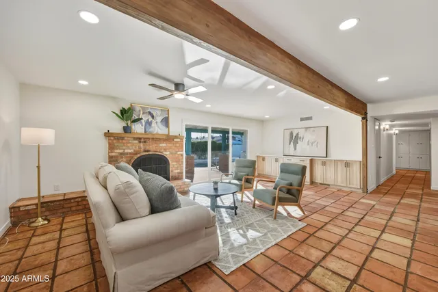 a dining room with furniture and chandelier