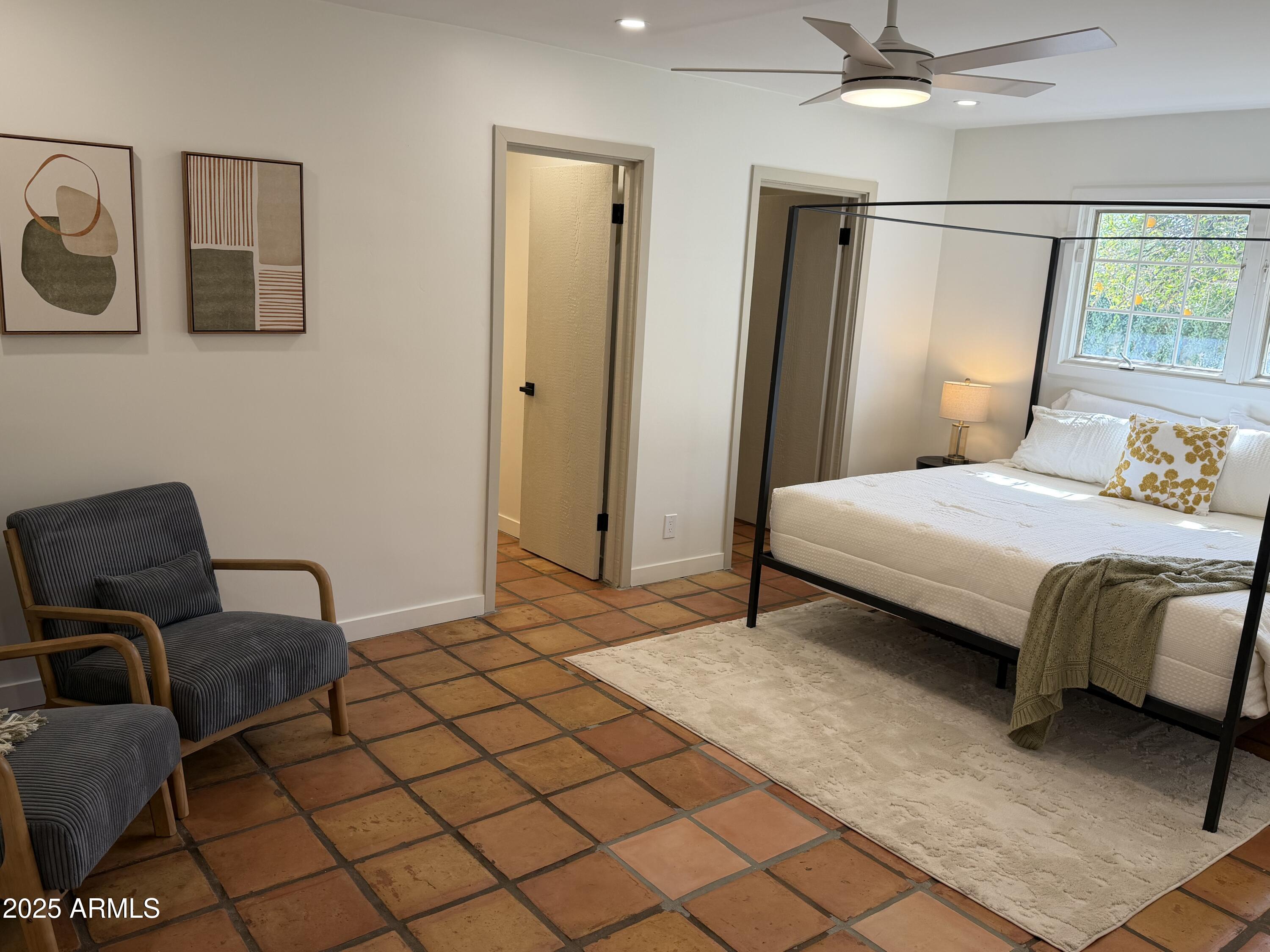 537 North Jay Street Chandler, AZ 85225 - Photo 14 of 39 a bedroom with a bed and chair