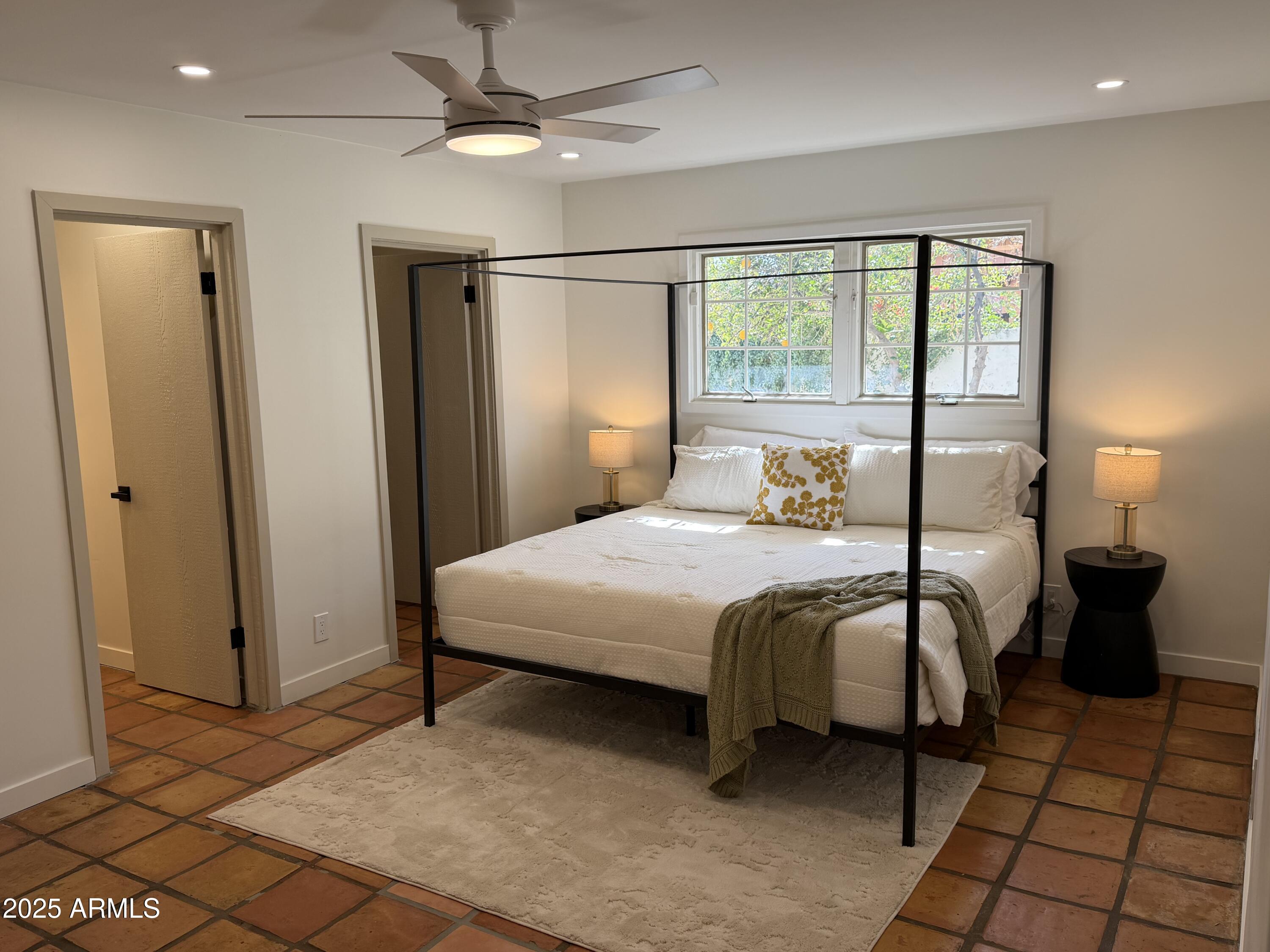 537 North Jay Street Chandler, AZ 85225 - Photo 15 of 39 a bedroom with a bed and wooden floor