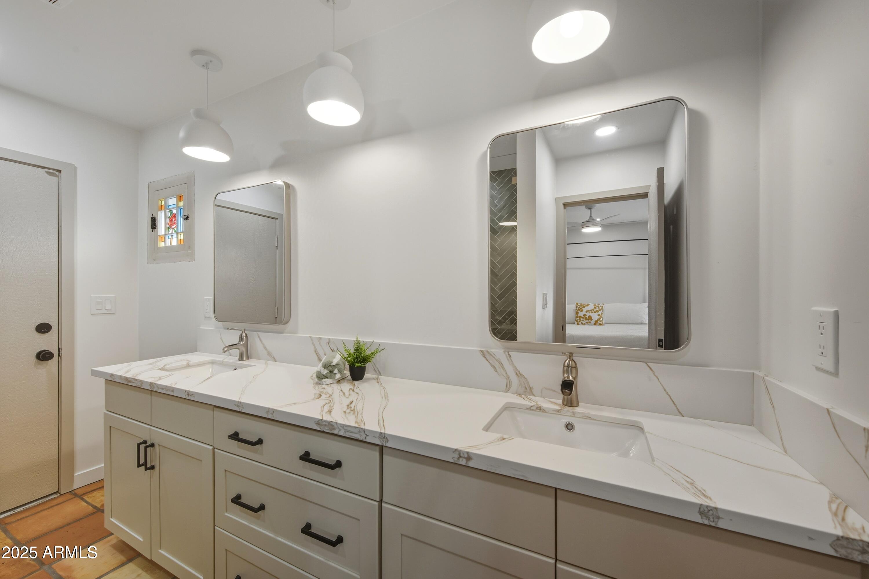 537 North Jay Street Chandler, AZ 85225 - Photo 18 of 39 a bathroom with a sink vanity granite and a mirror
