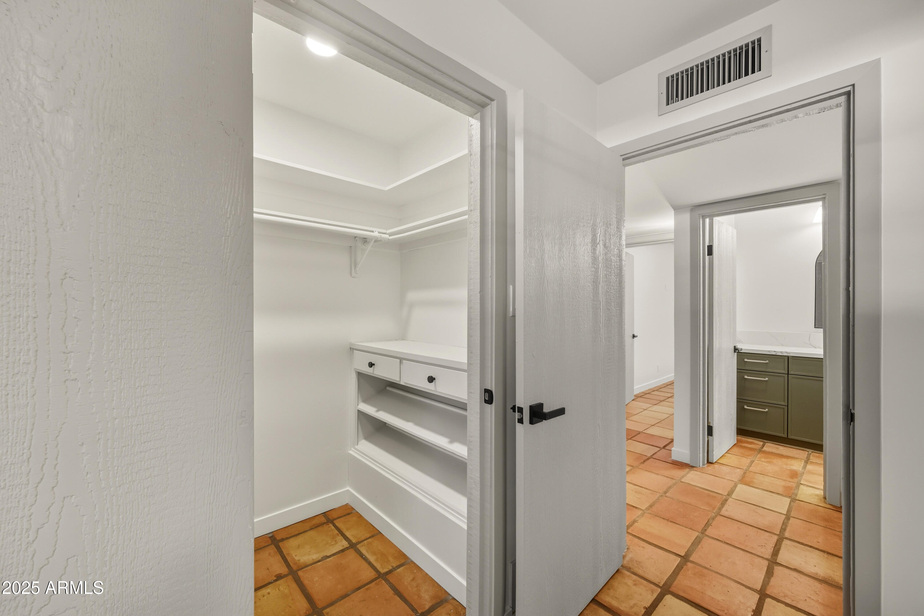 537 North Jay Street Chandler, AZ 85225 - Photo 24 of 39 a view of a hallway with wooden floor and closet