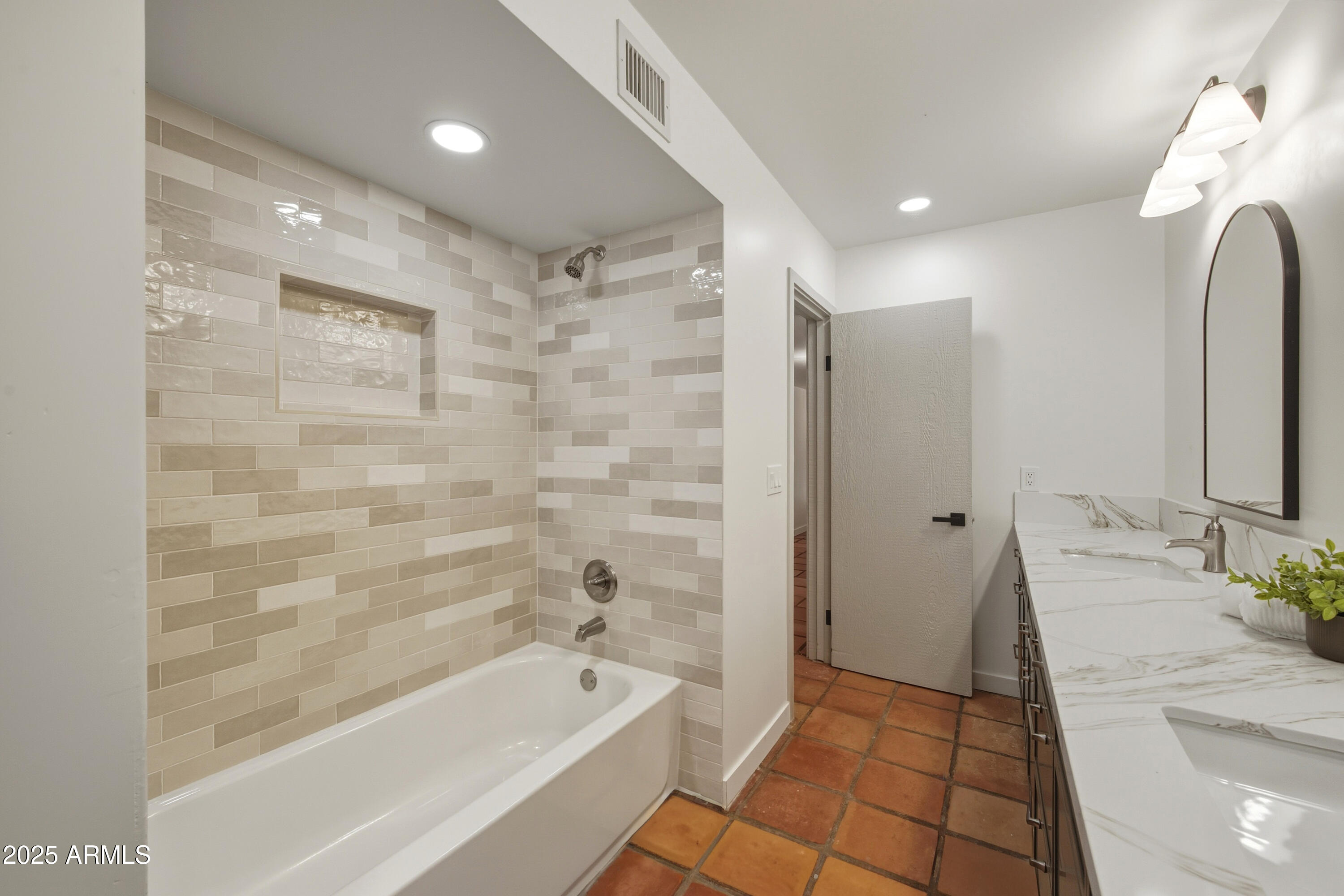 537 North Jay Street Chandler, AZ 85225 - Photo 26 of 39 a bathroom with a bathtub and a sink