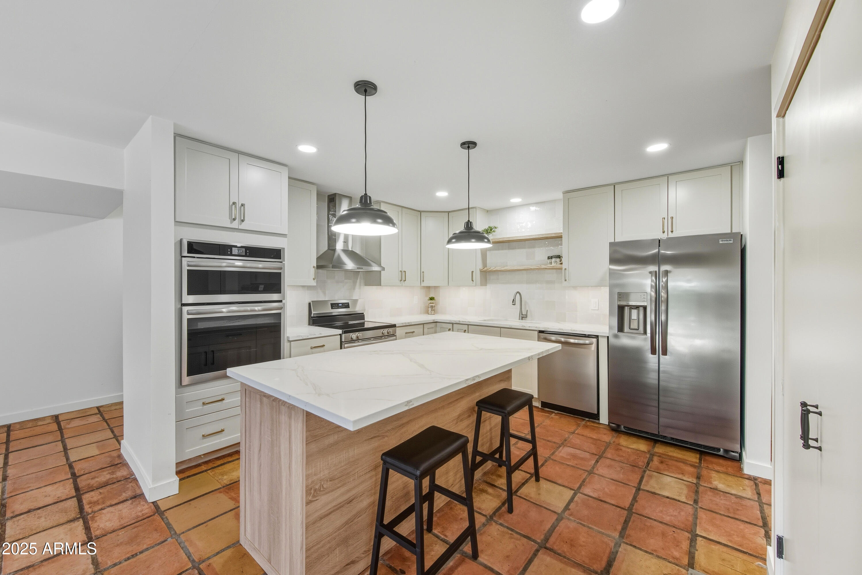 537 North Jay Street Chandler, AZ 85225 - Photo 2 of 39 a kitchen with kitchen island a counter space appliances and cabinets
