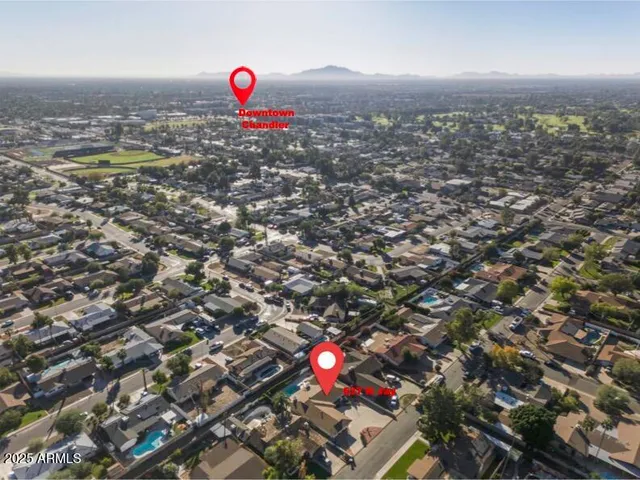 an aerial view of a house stairs and a yard