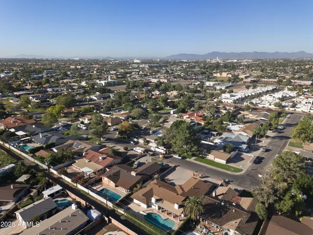 an aerial view of houses with yard