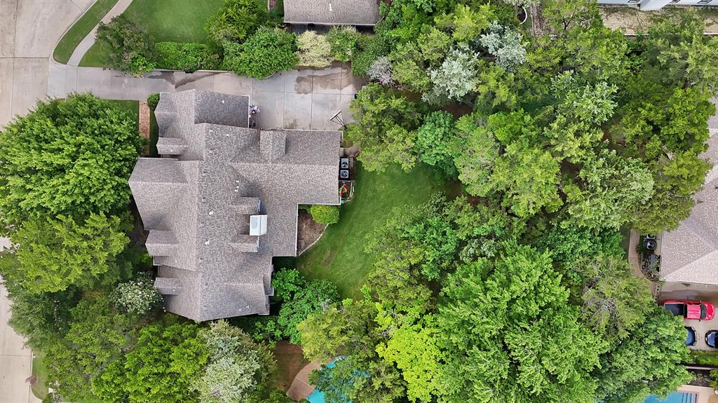 1912 Timber Ridge Court Cedar Hill, TX 75104 - Photo 4 of 35 Residential property with complex roofline and multiple chimneys, surrounded by mature trees
