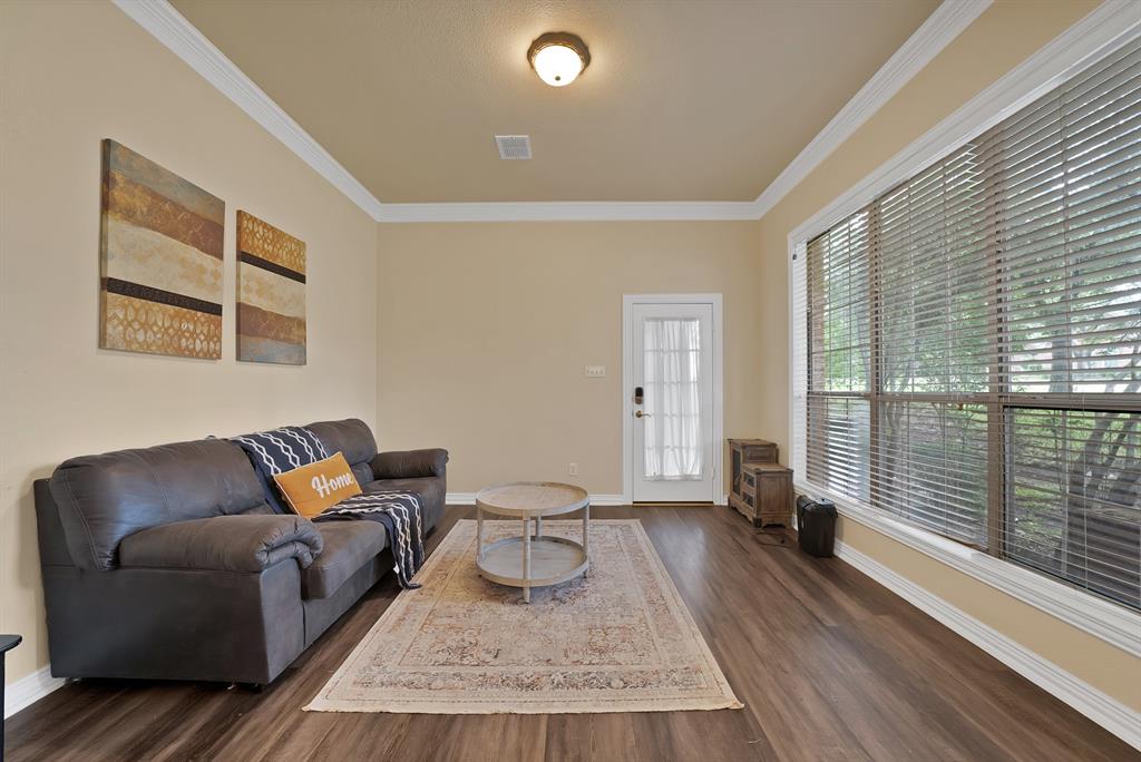 1912 Timber Ridge Court Cedar Hill, TX 75104 - Photo 5 of 35 Spacious room featuring wood-finish flooring, light-toned walls, and a large window with blinds