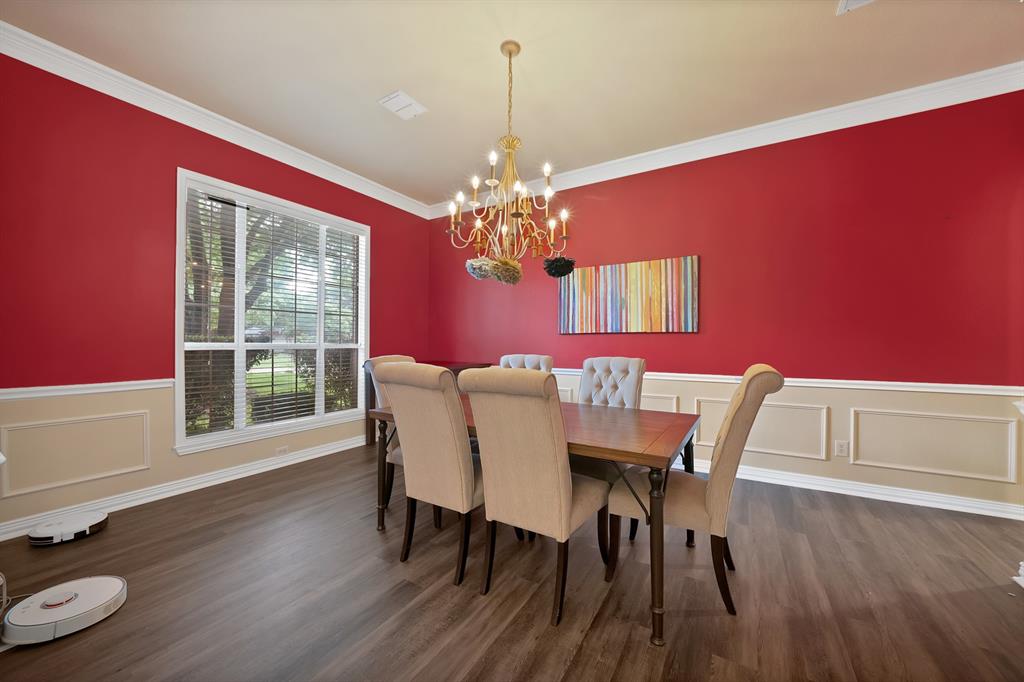 1912 Timber Ridge Court Cedar Hill, TX 75104 - Photo 7 of 35 Spacious room featuring wood-finish flooring, a large window with blinds, and decorative wall molding