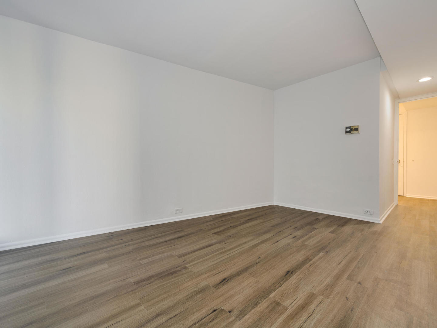 300 North State Street, Unit 3330 Chicago, IL 60654 - Photo 11 of 20 a view of an empty room and wooden floor