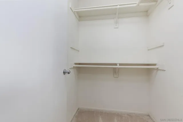 a view of a room with racks on the wall