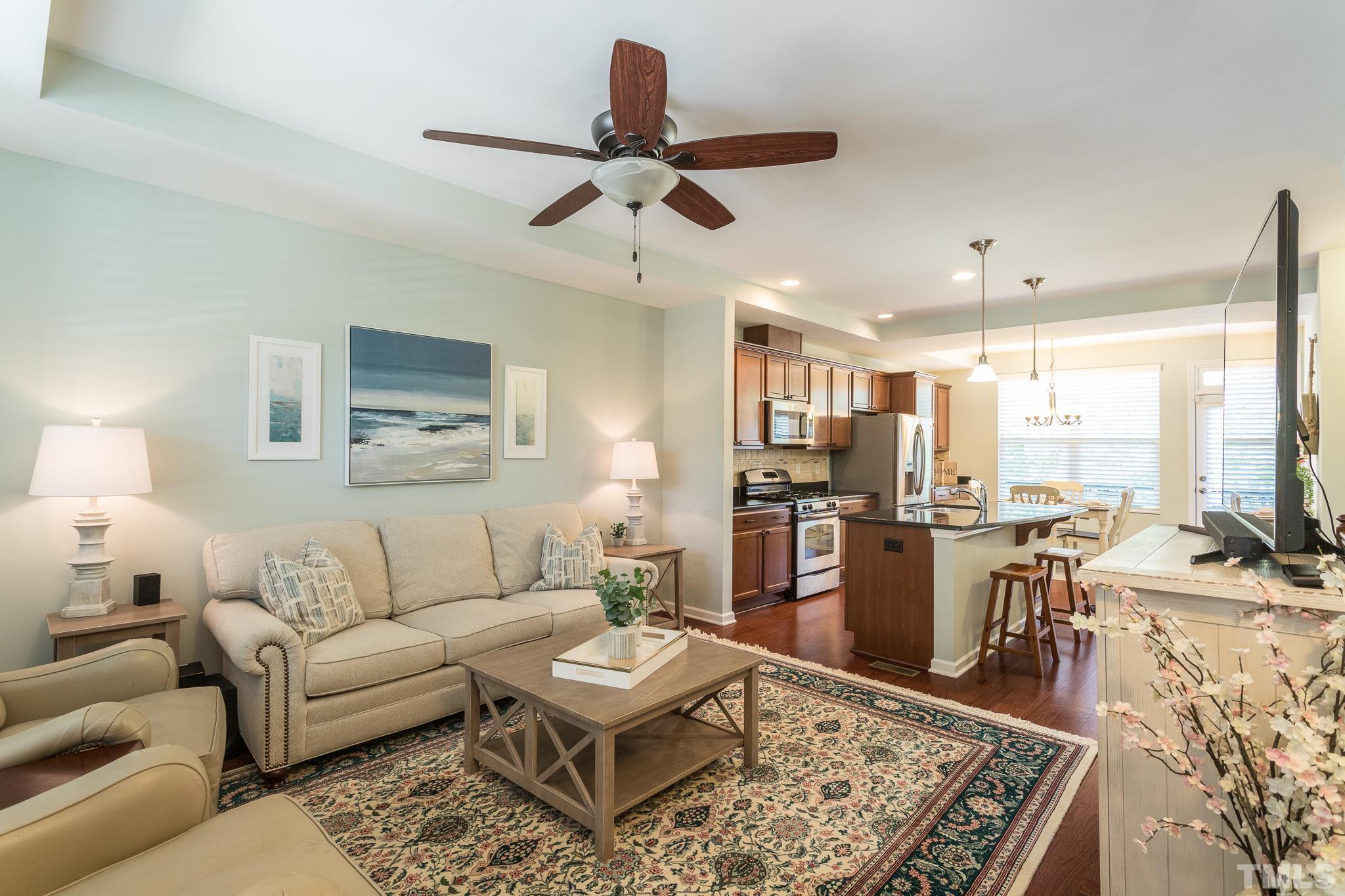 1621 Crafton Way Raleigh, NC 27607 - Photo 7 of 30 a living room with furniture kitchen view and a large window