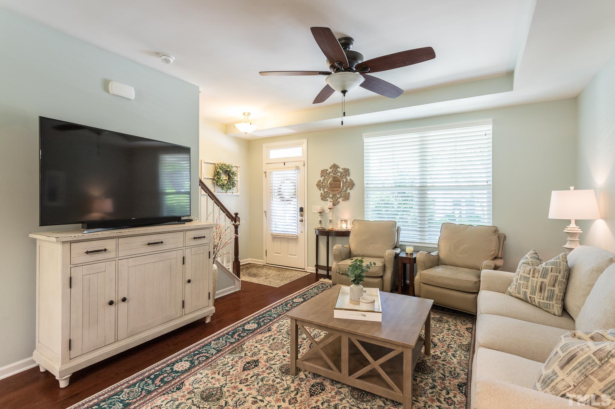 1621 Crafton Way Raleigh, NC 27607 - Photo 8 of 30 a living room with furniture and a flat screen tv