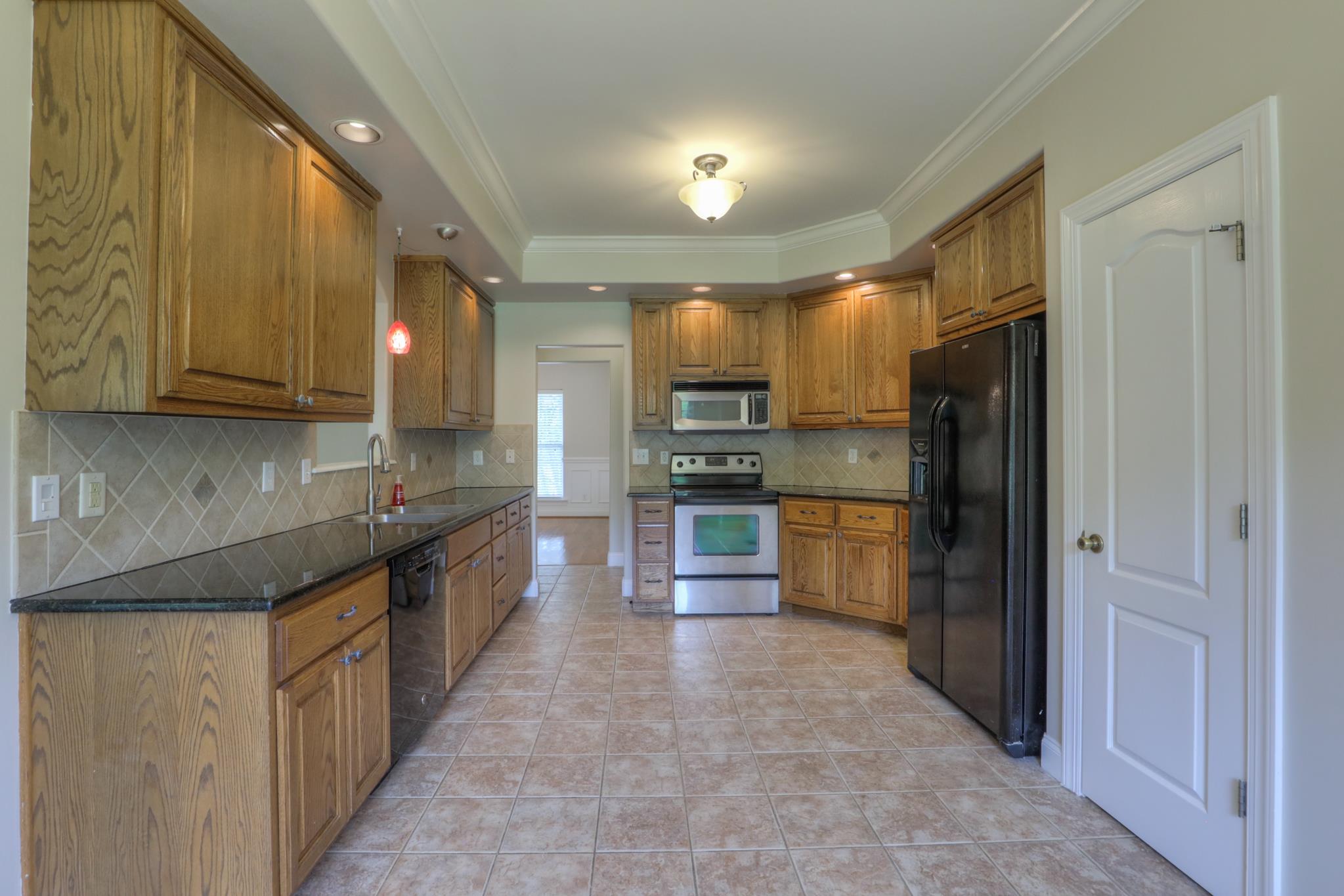 202 Ridgewater Way Mount Juliet, TN 37122 - Photo 13 of 30 a kitchen with stainless steel appliances granite countertop a refrigerator and a stove top oven