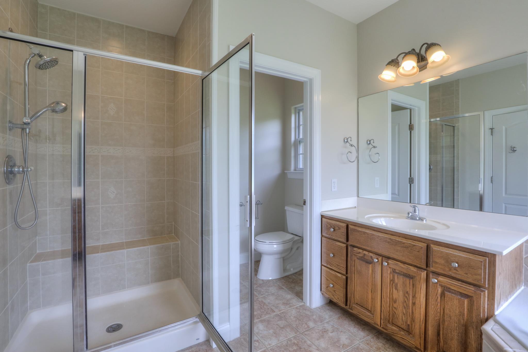 202 Ridgewater Way Mount Juliet, TN 37122 - Photo 18 of 30 a bathroom with a shower sink vanity and toilet