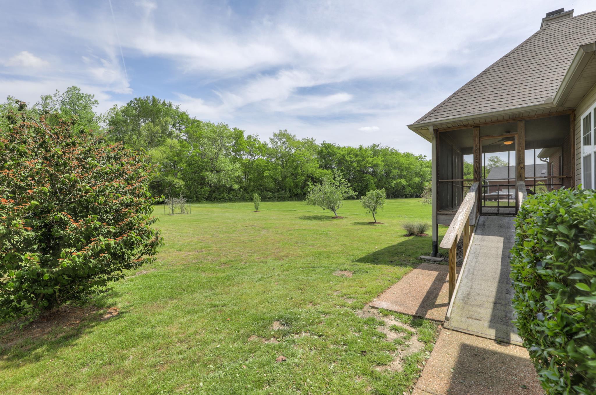 202 Ridgewater Way Mount Juliet, TN 37122 - Photo 4 of 30 a view of a house with a backyard