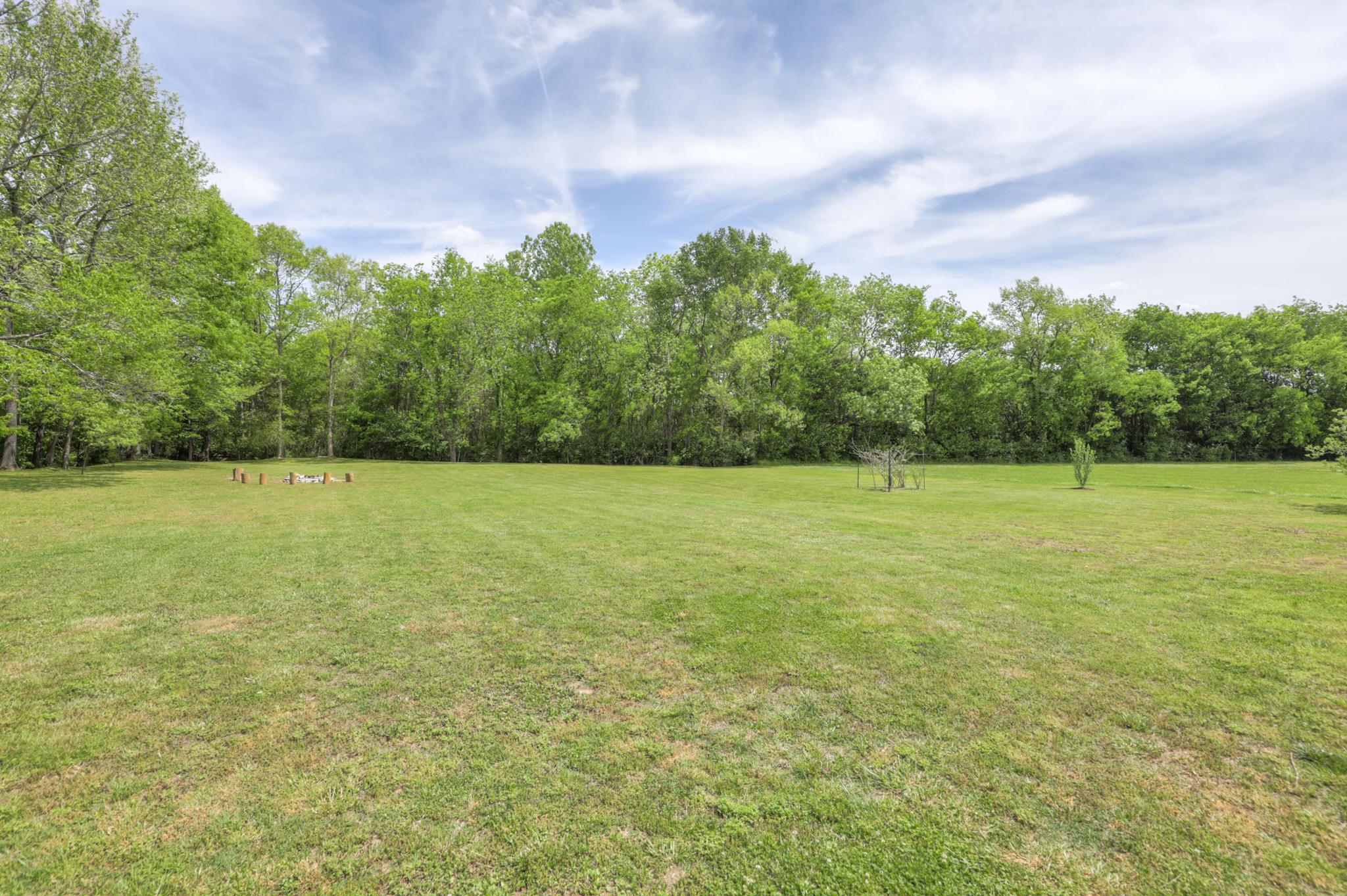 202 Ridgewater Way Mount Juliet, TN 37122 - Photo 7 of 30 a view of a field with an trees in the background
