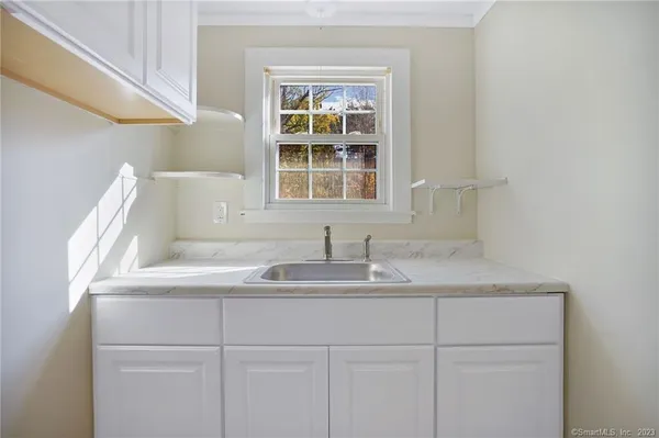 a kitchen with a sink and a window