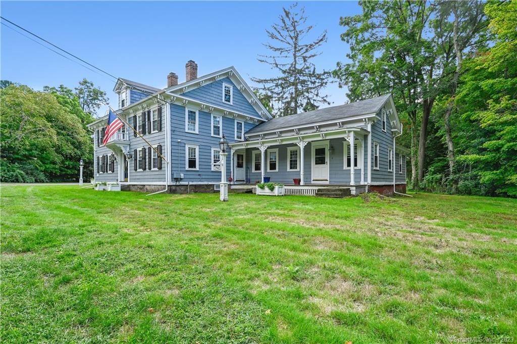 752 Main Street, Unit 5 Somers, CT 06071 - Photo 2 of 17 front view of a house with a yard