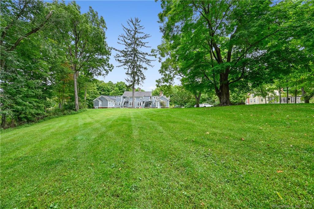 752 Main Street, Unit 5 Somers, CT 06071 - Photo 6 of 17 a view of a house with a yard