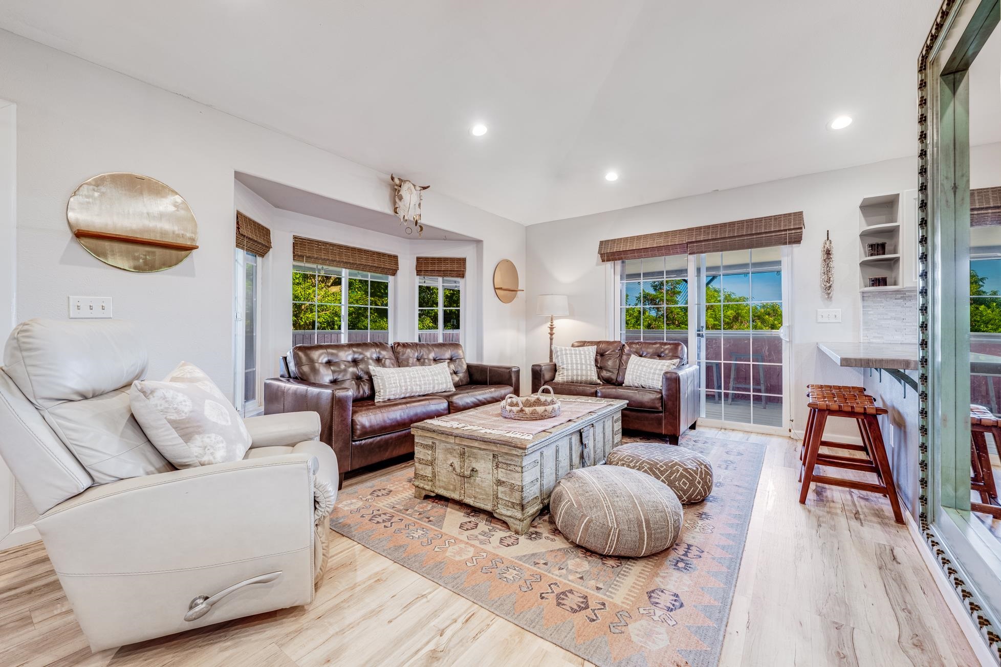 951 Kokomo Road Haiku, HI 96708 - Photo 11 of 50 a living room with furniture and a large window