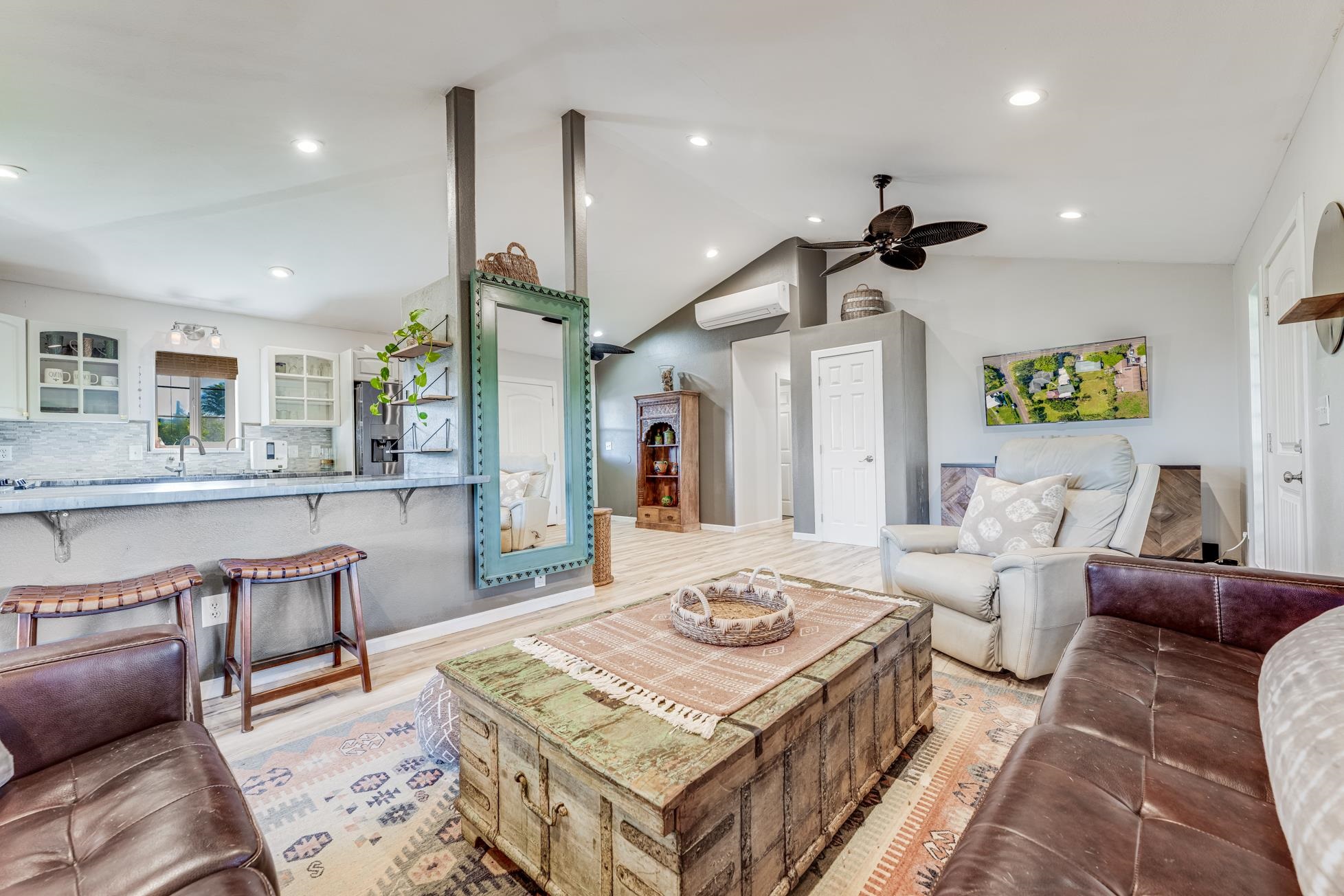 951 Kokomo Road Haiku, HI 96708 - Photo 12 of 50 a living room with furniture and a table