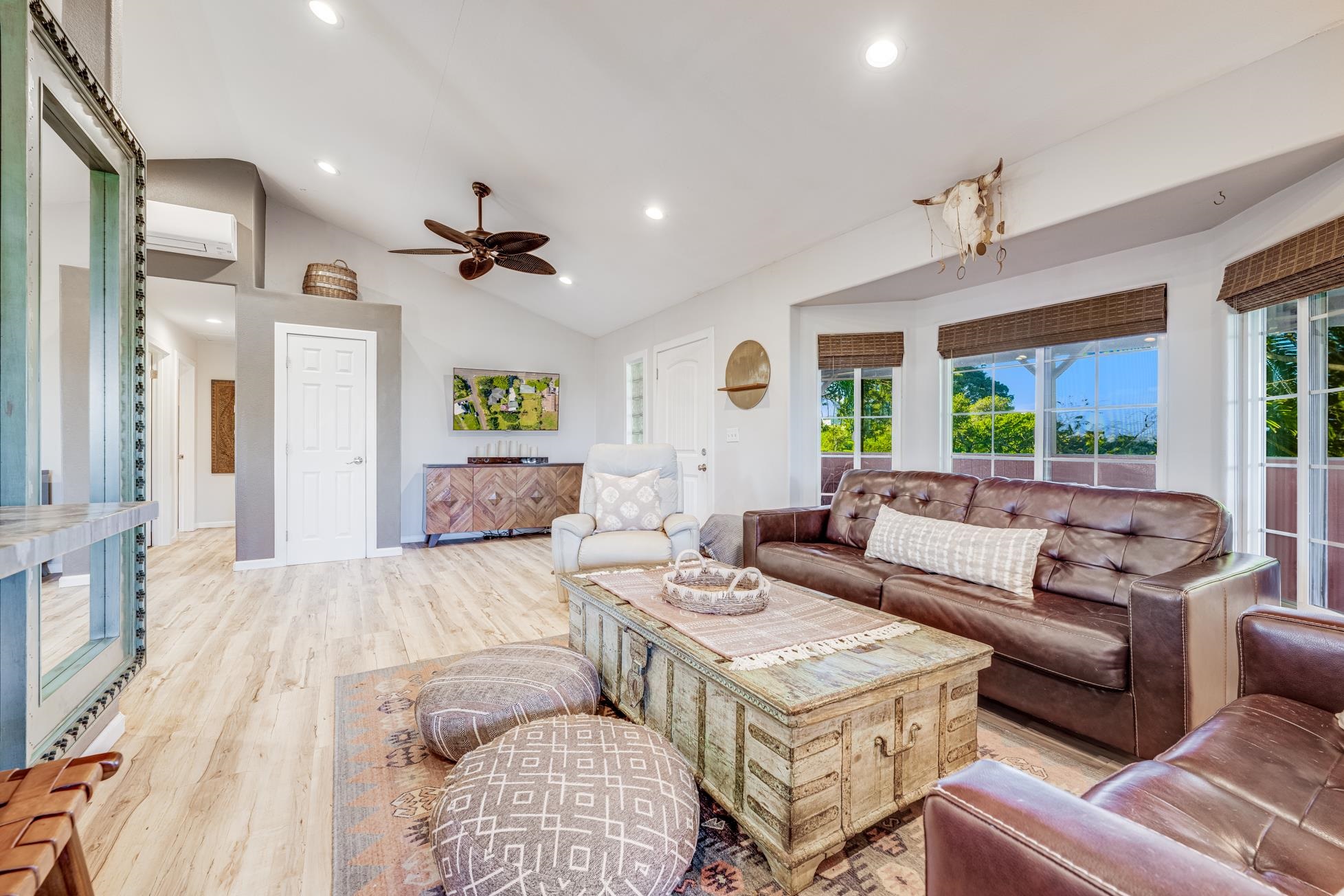 951 Kokomo Road Haiku, HI 96708 - Photo 13 of 50 a living room with furniture a ceiling fan and a rug