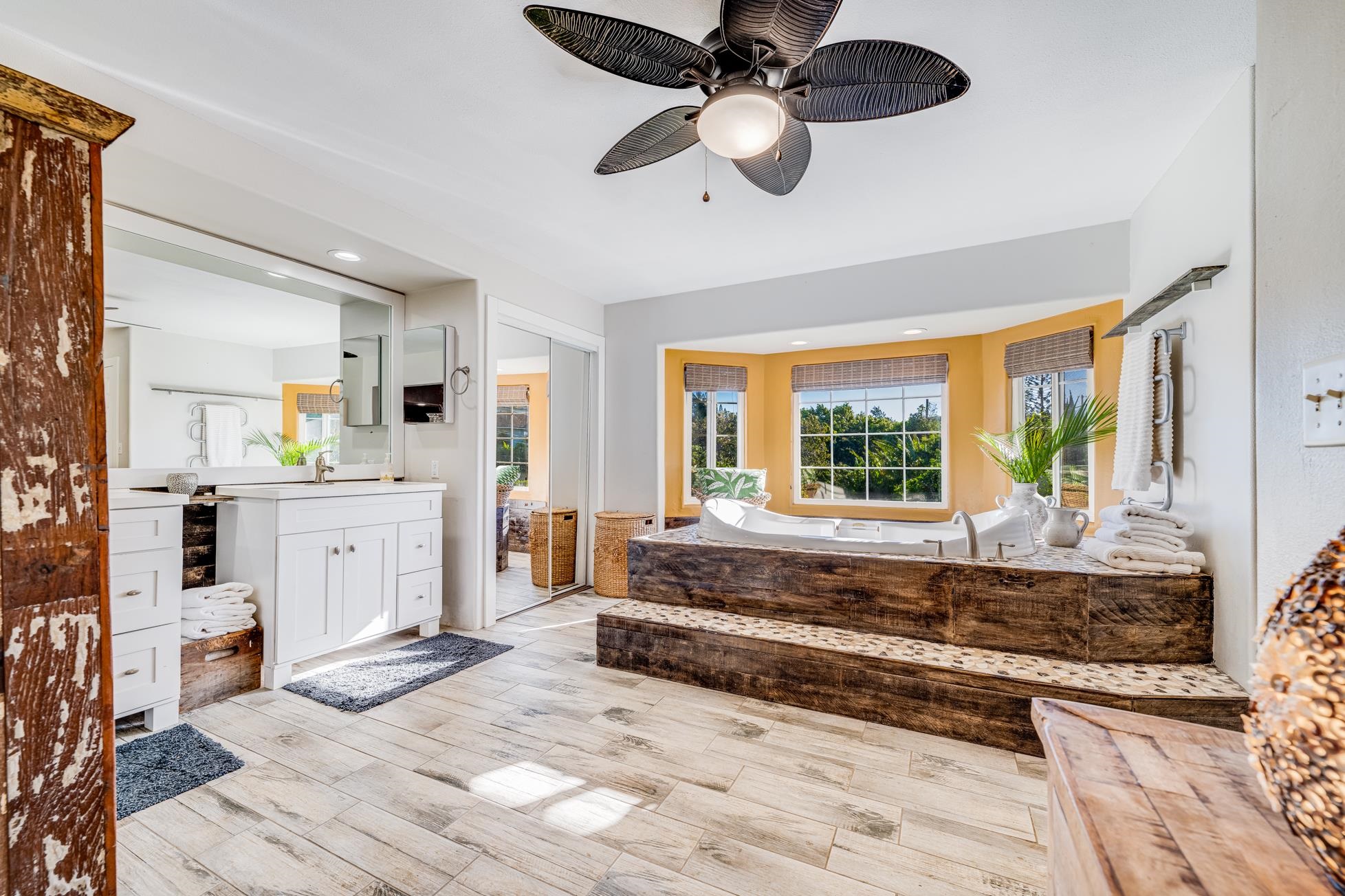951 Kokomo Road Haiku, HI 96708 - Photo 21 of 50 a living room with kitchen island furniture and a large window