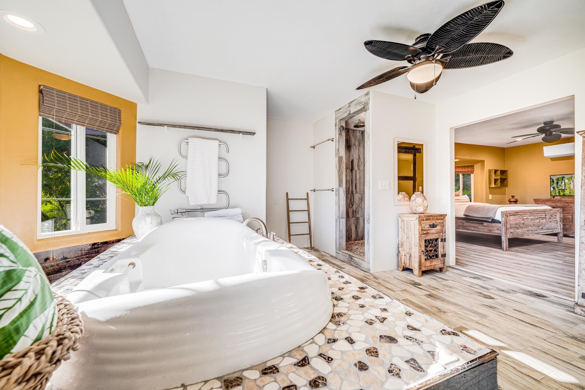 951 Kokomo Road Haiku, HI 96708 - Photo 23 of 50 a living room with a bed furniture and a window