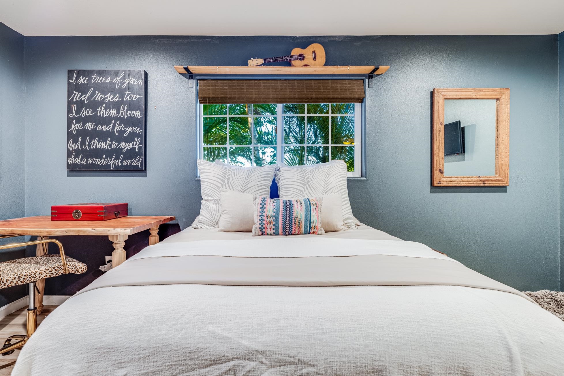 951 Kokomo Road Haiku, HI 96708 - Photo 27 of 50 a bedroom with a bed and a window