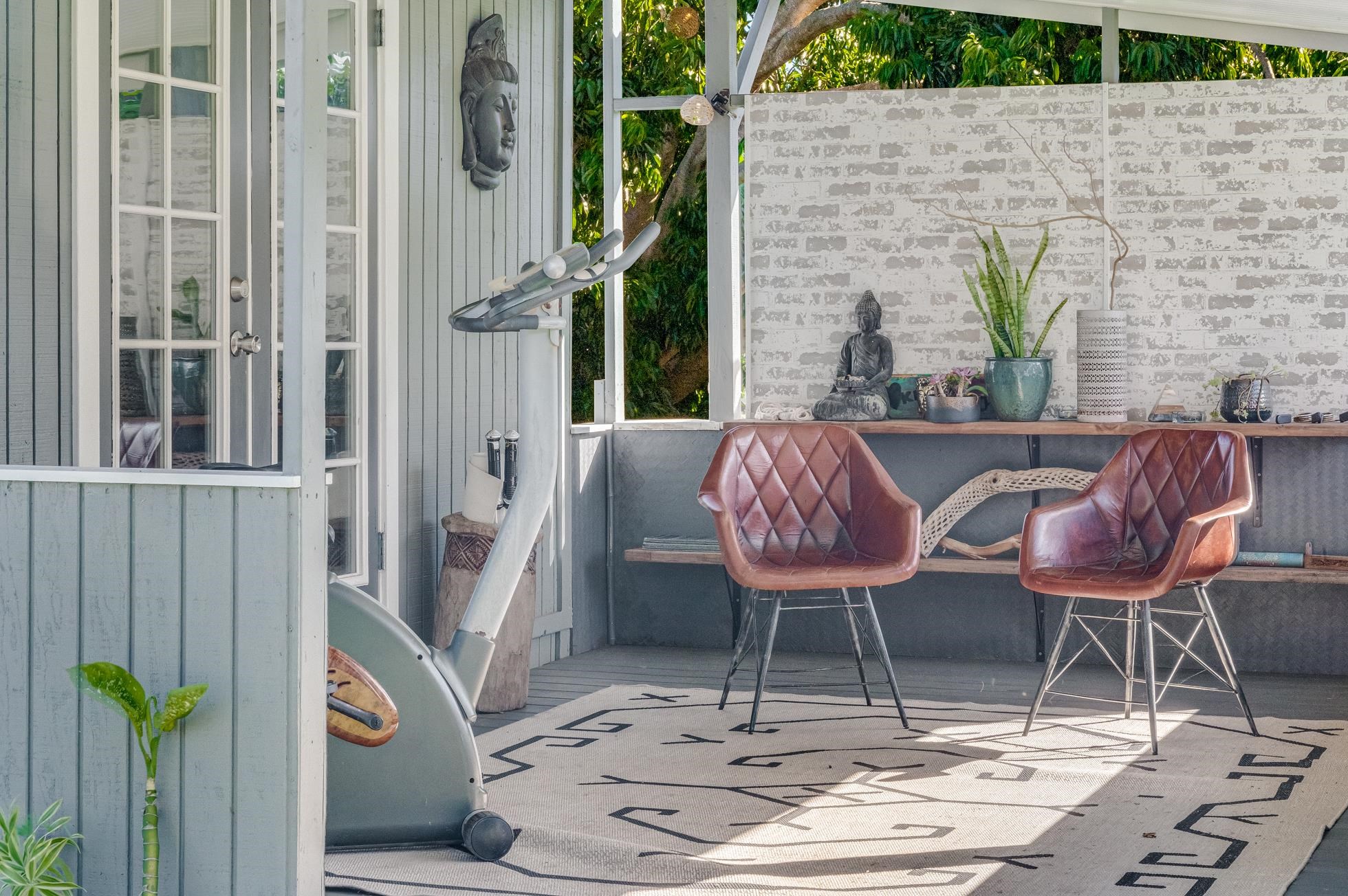 951 Kokomo Road Haiku, HI 96708 - Photo 34 of 50 a dining room with furniture and a potted plant