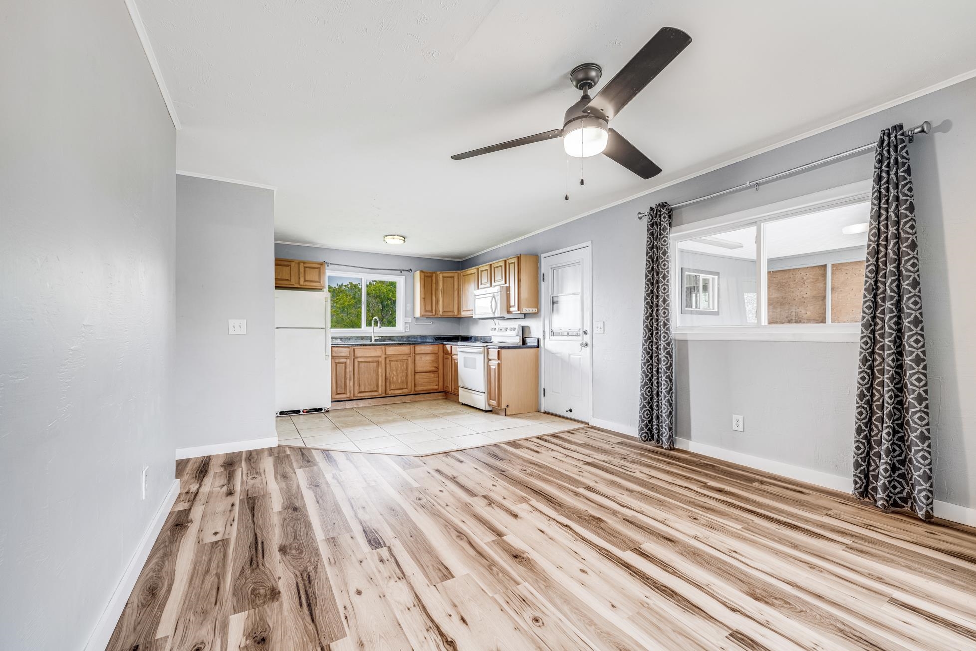 951 Kokomo Road Haiku, HI 96708 - Photo 38 of 50 a room with a bed and a window