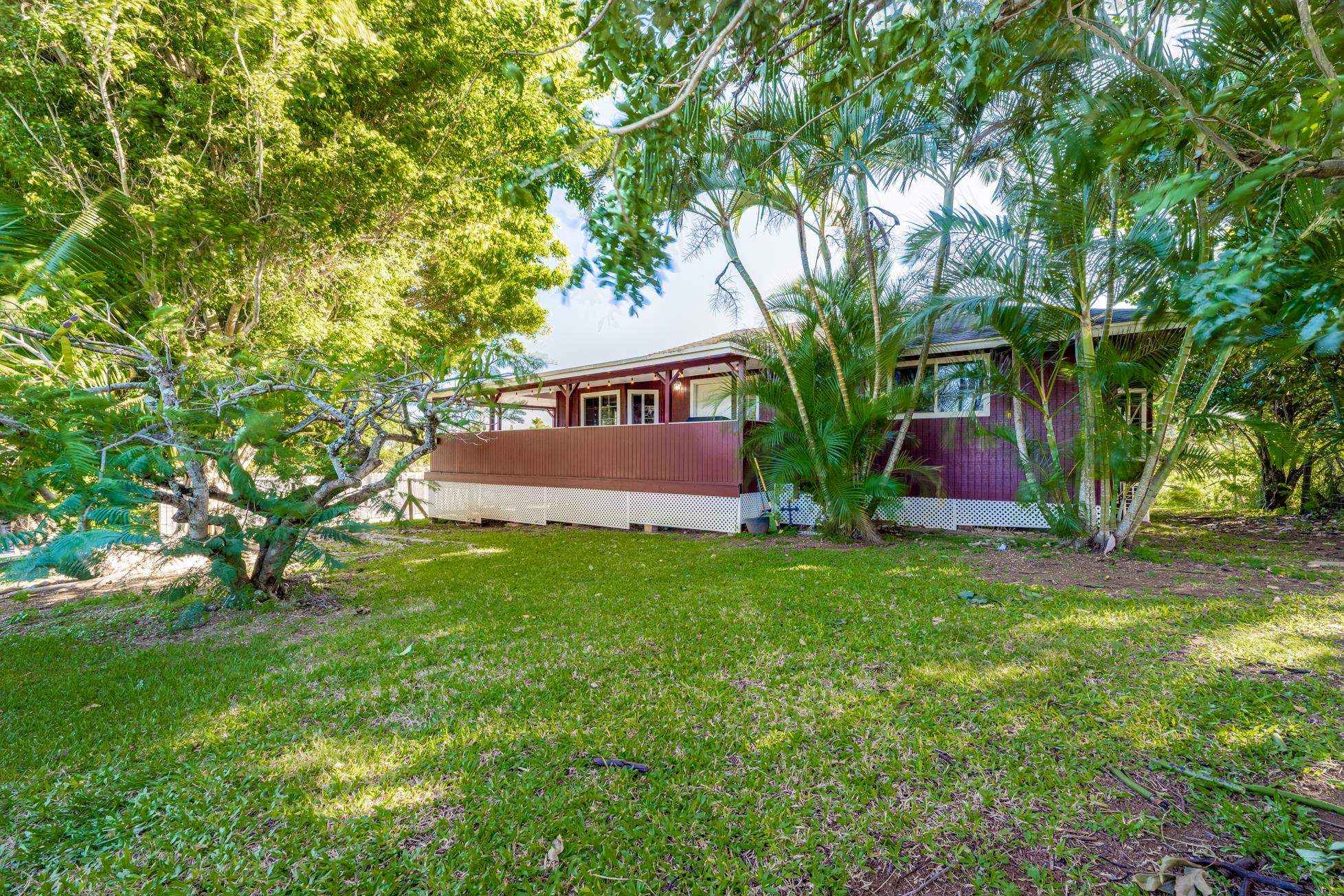 951 Kokomo Road Haiku, HI 96708 - Photo 4 of 50 a view of front of house with a yard