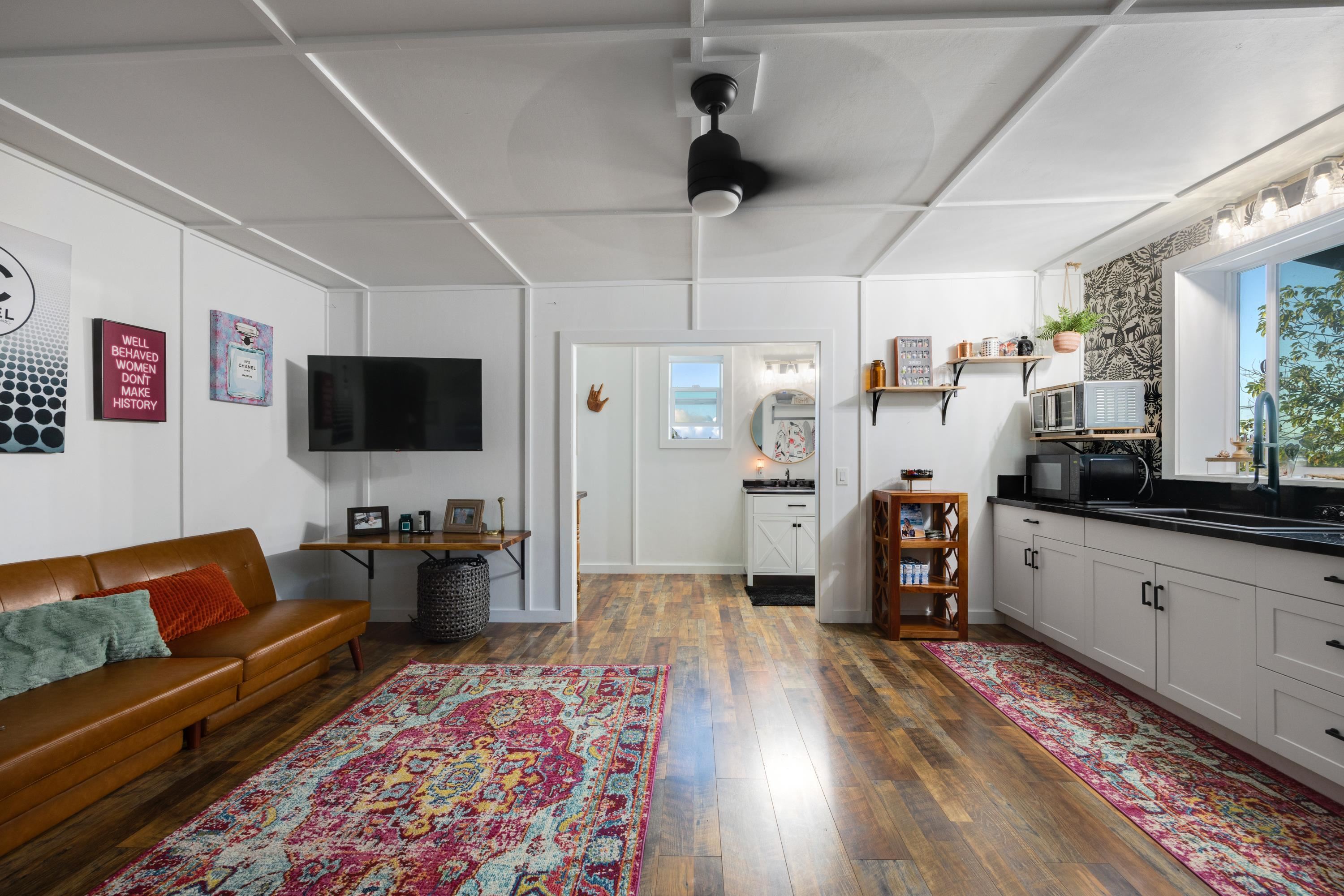 951 Kokomo Road Haiku, HI 96708 - Photo 47 of 50 a living room with furniture and a flat screen tv