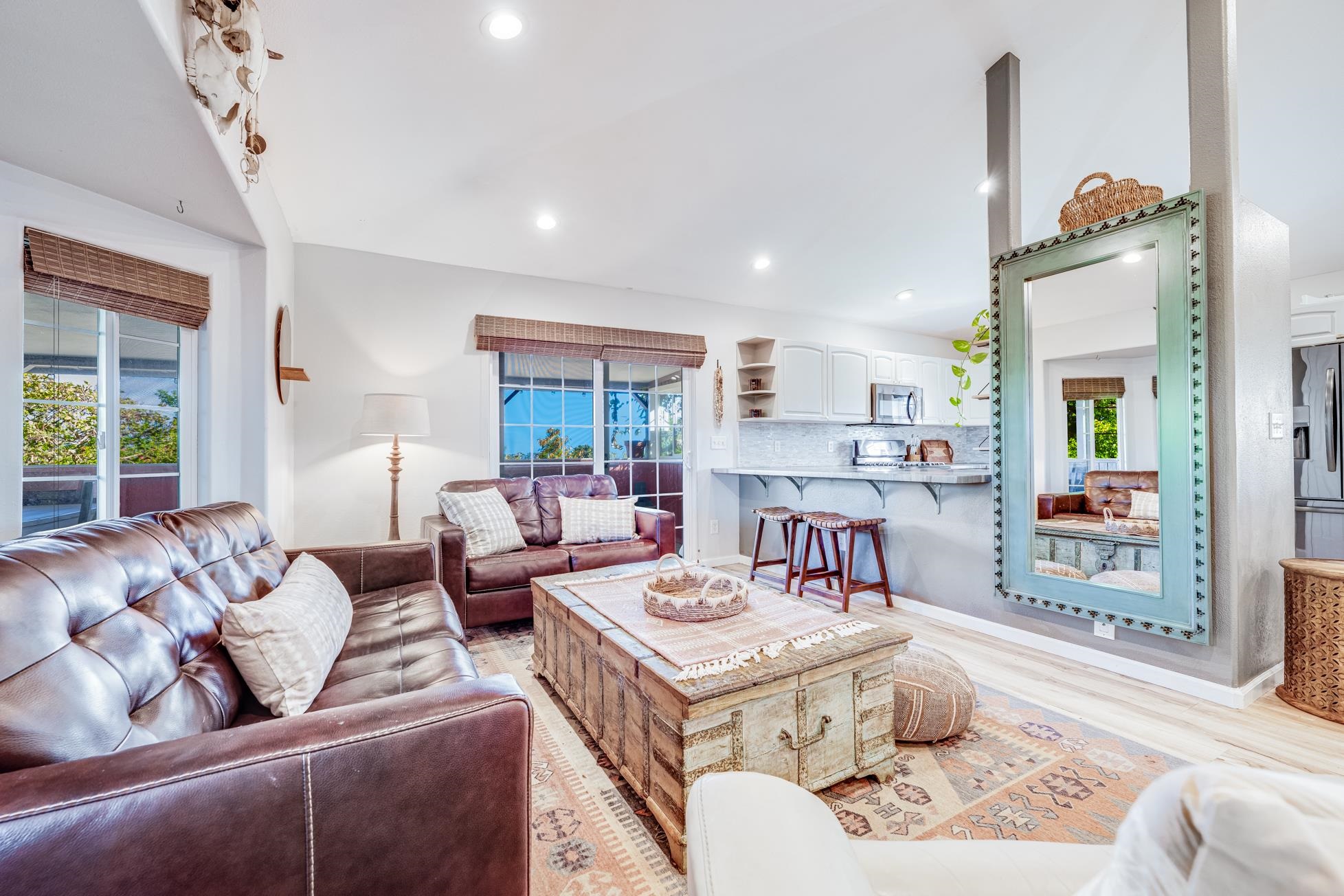 951 Kokomo Road Haiku, HI 96708 - Photo 10 of 50 a living room with furniture and a large window