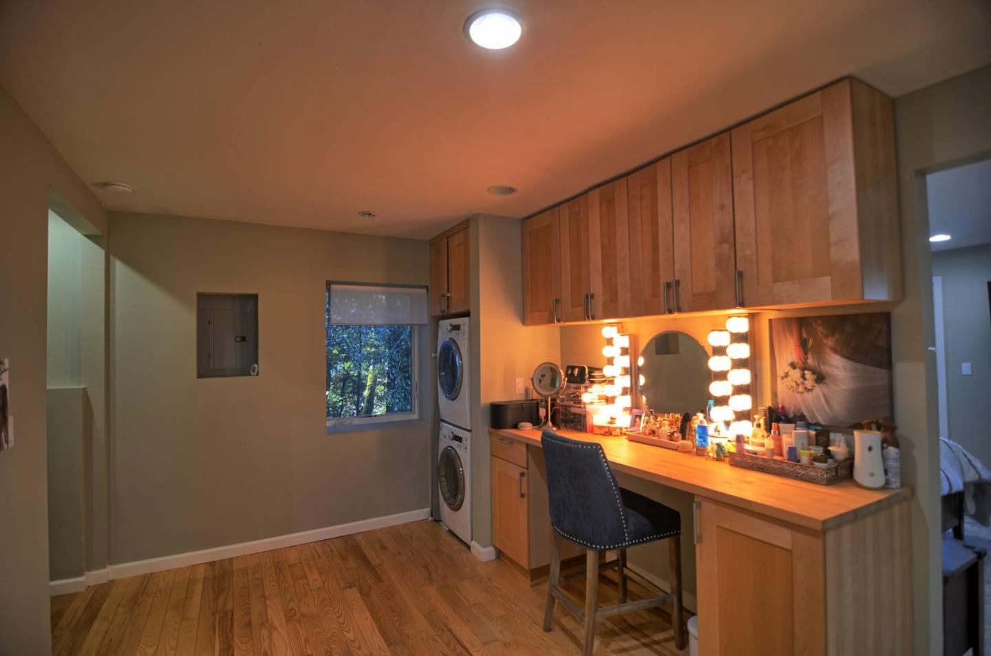 254 Swett Road Woodside, CA 94062 - Photo 12 of 26 a kitchen with granite countertop white cabinets and chairs