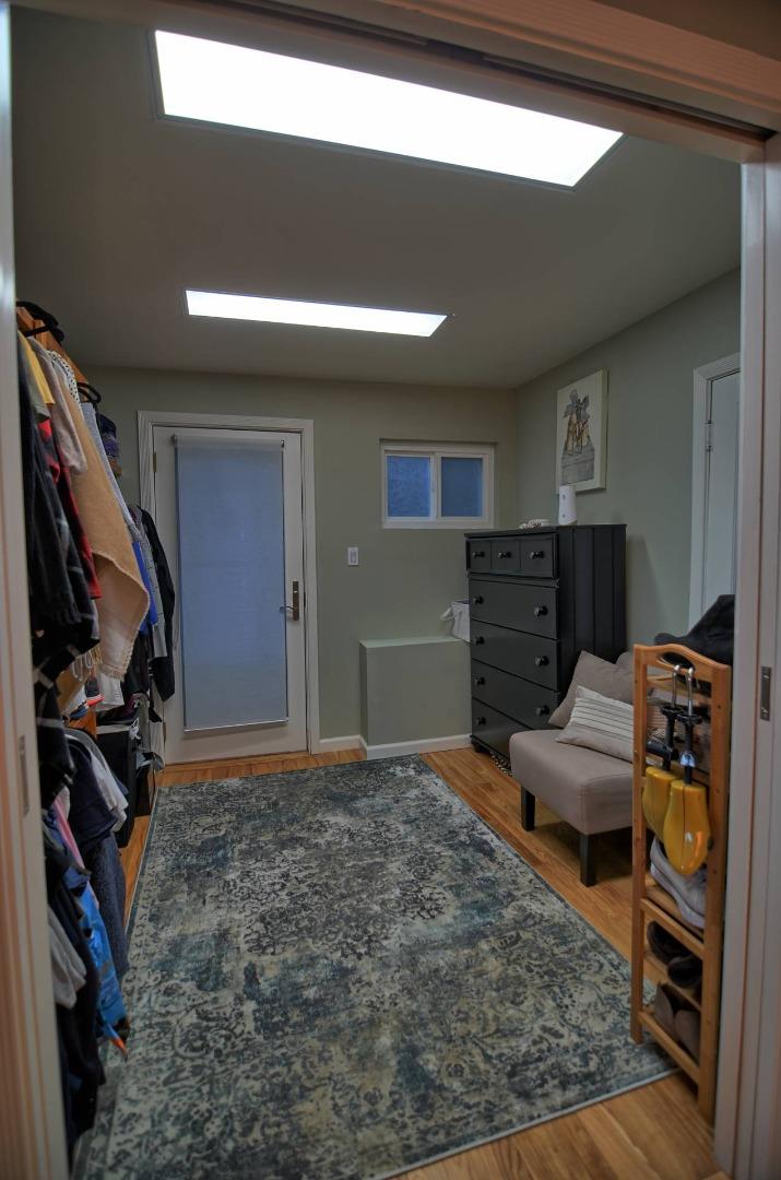 254 Swett Road Woodside, CA 94062 - Photo 14 of 26 a living room with furniture and a flat screen tv