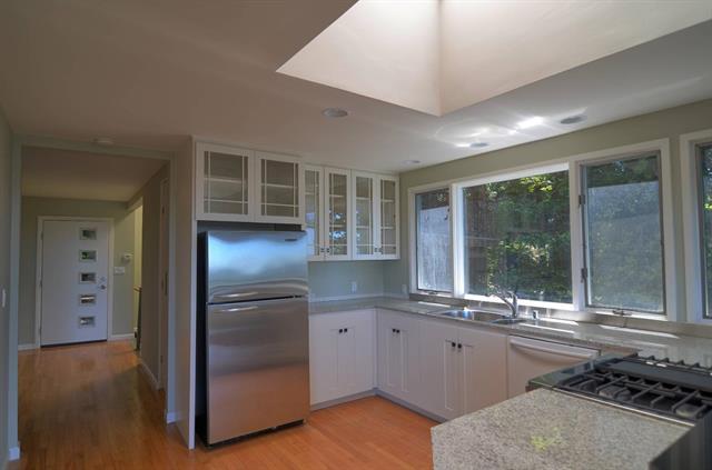 254 Swett Road Woodside, CA 94062 - Photo 3 of 26 a kitchen with a refrigerator and a sink