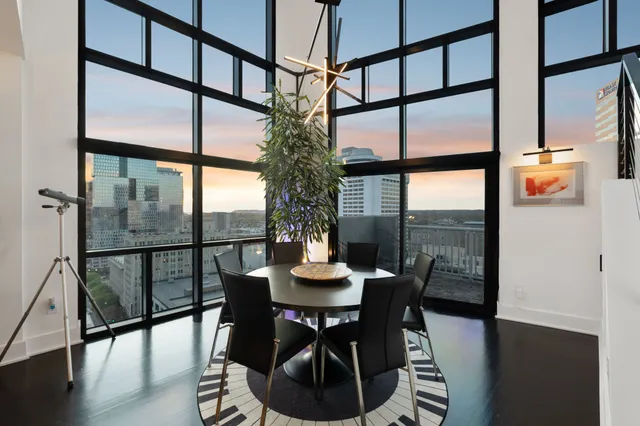 a view of a dining room with furniture window and wooden floor