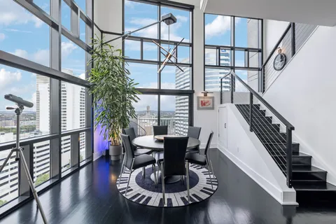 a view of a dining room with furniture window and wooden floor
