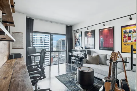 a living room with furniture and a flat screen tv