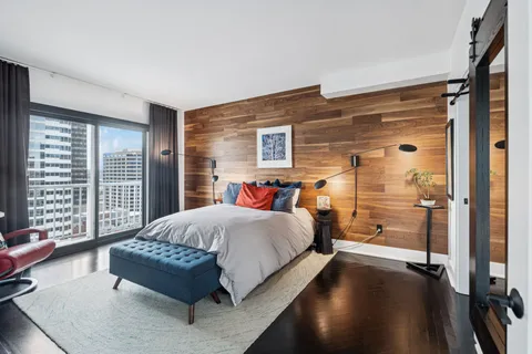 a bed room with a bed and a couch