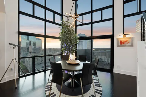 a view of a dining room with furniture window and wooden floor