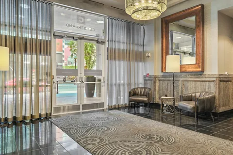 a living room with furniture and a large window