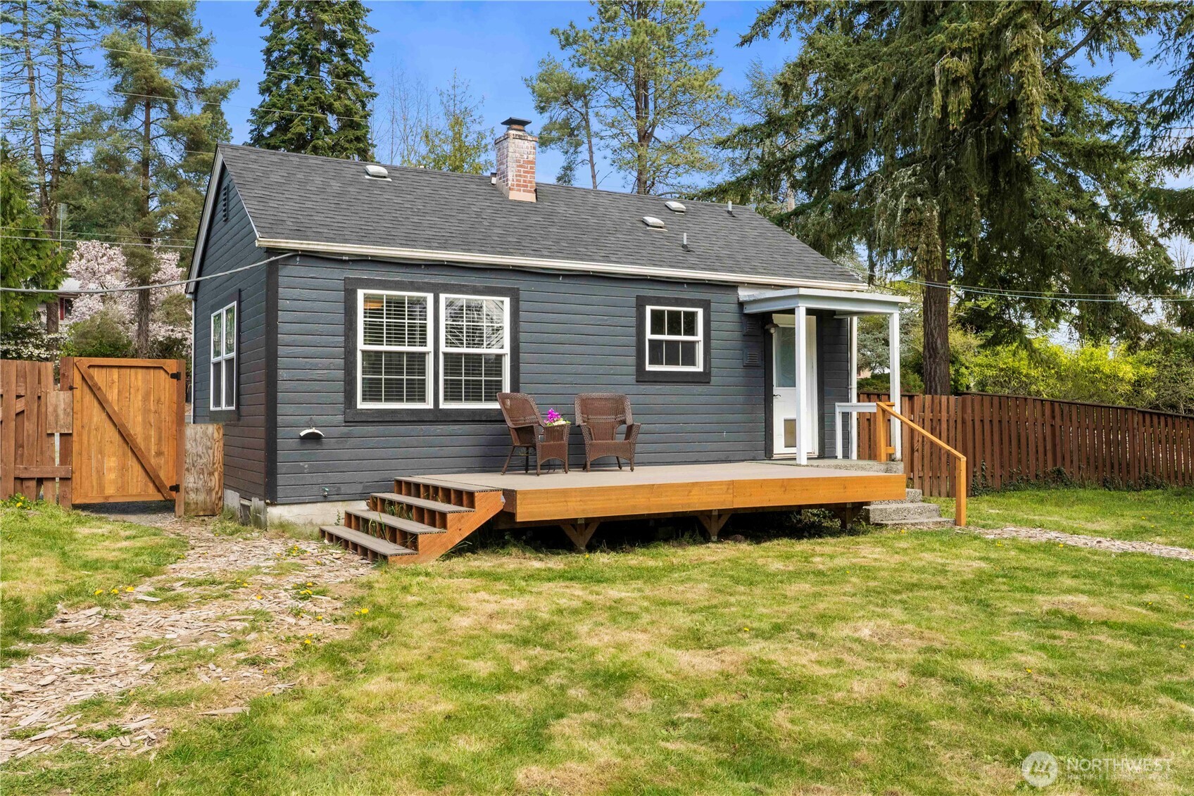 11716 48th Street East Edgewood, WA 98372 - Photo 18 of 29 a view of a house with pool and chairs