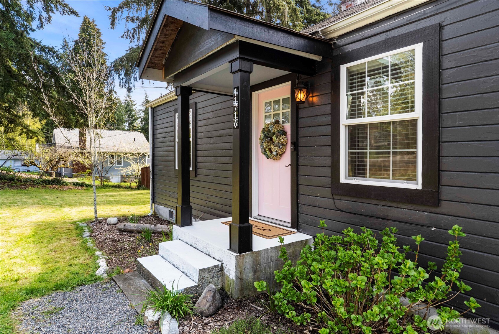 11716 48th Street East Edgewood, WA 98372 - Photo 2 of 29 a front view of a house with garden
