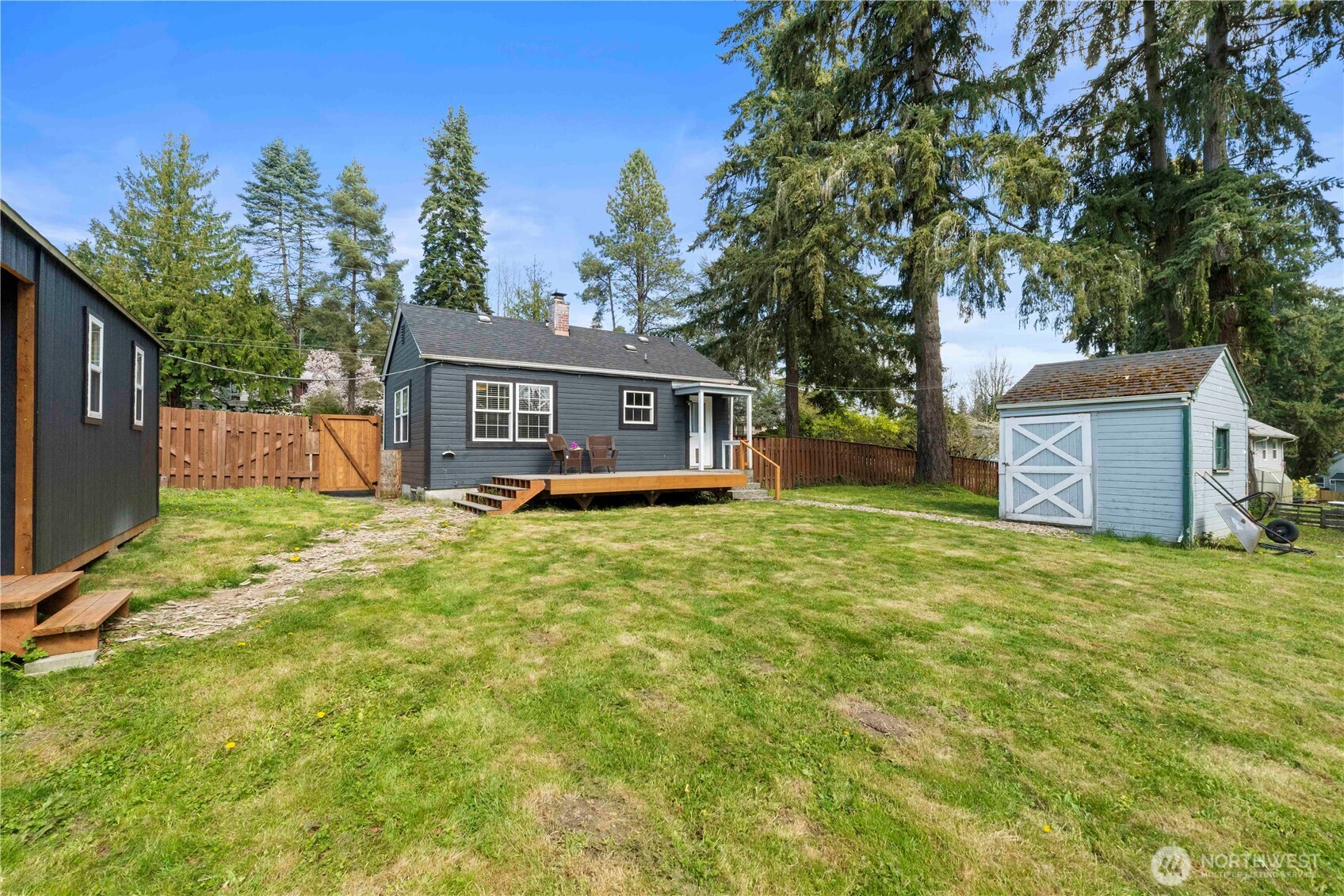 11716 48th Street East Edgewood, WA 98372 - Photo 22 of 29 a front view of house with yard and trees
