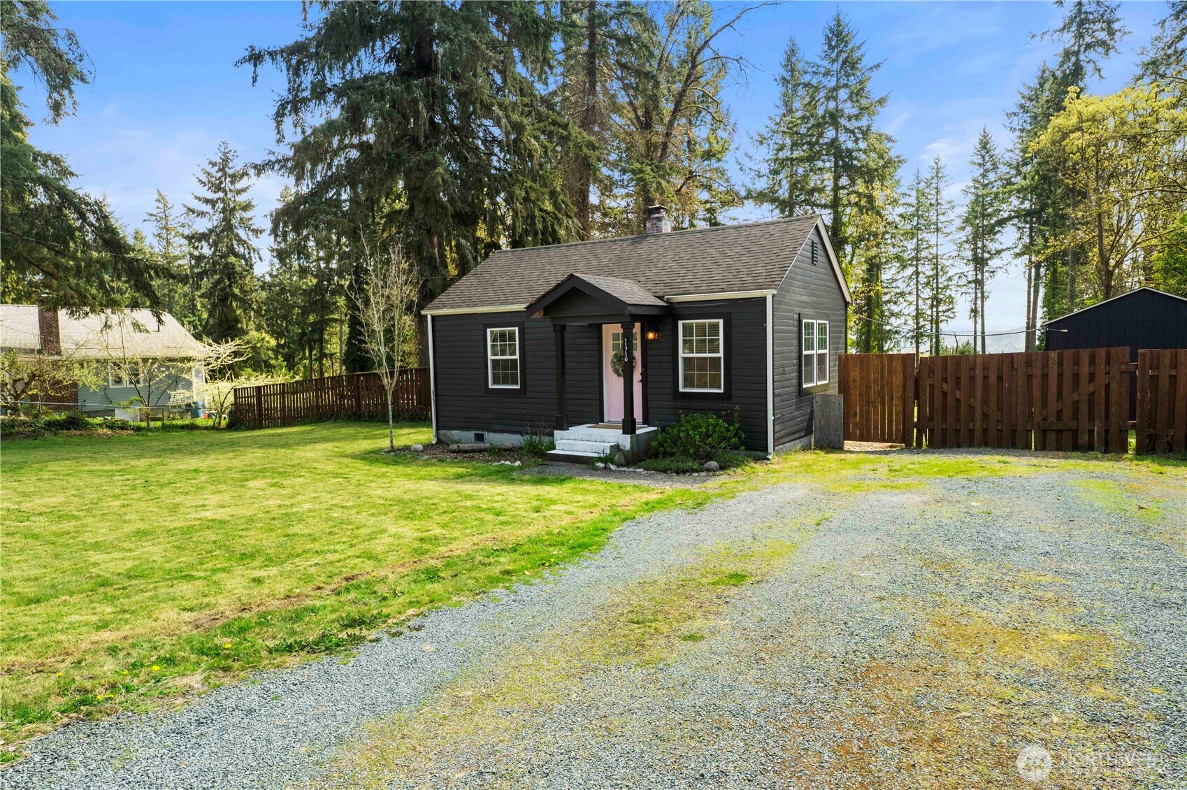 11716 48th Street East Edgewood, WA 98372 - Photo 29 of 29 a front view of house with yard and trees