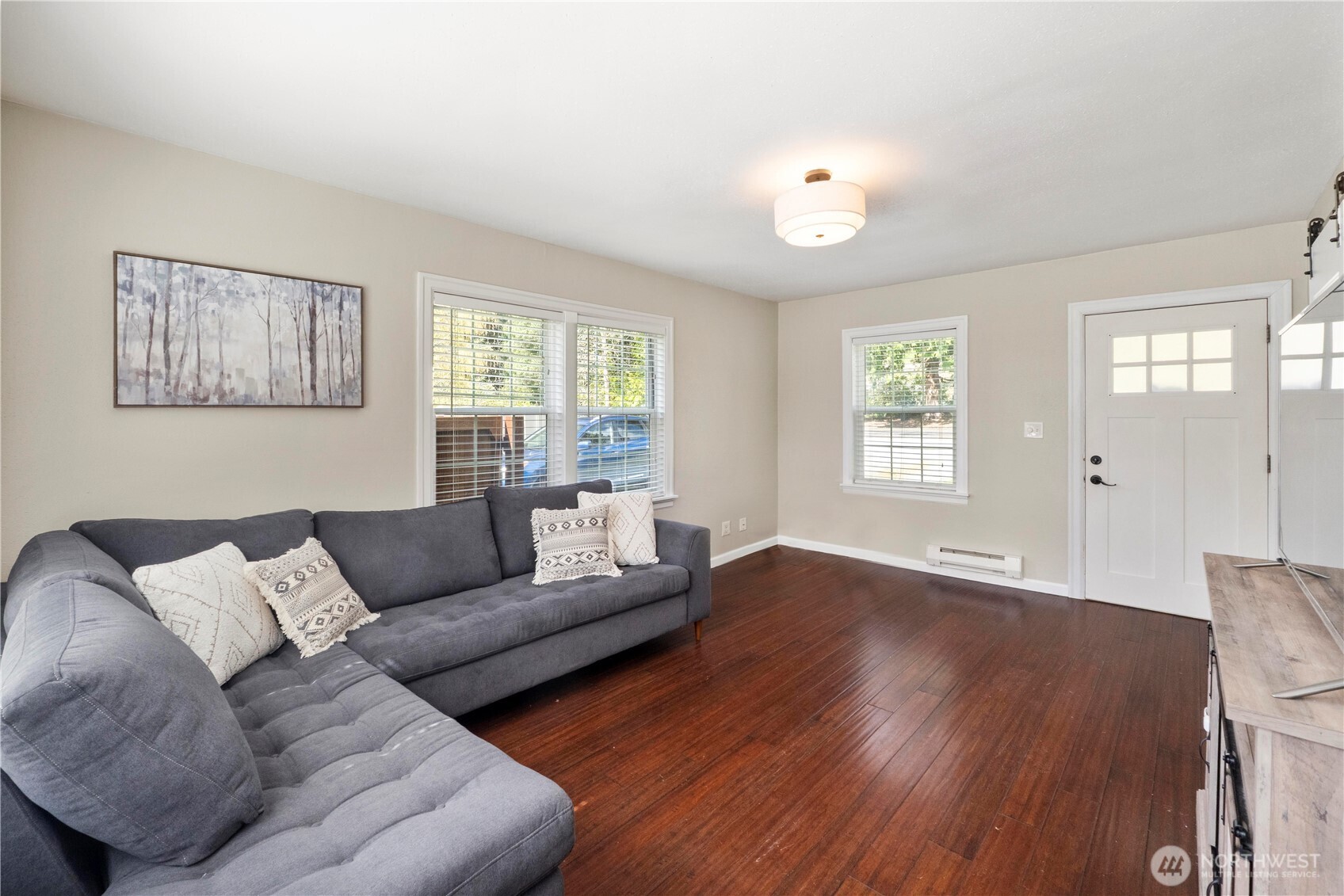 11716 48th Street East Edgewood, WA 98372 - Photo 3 of 29 a living room with furniture and a wooden floor