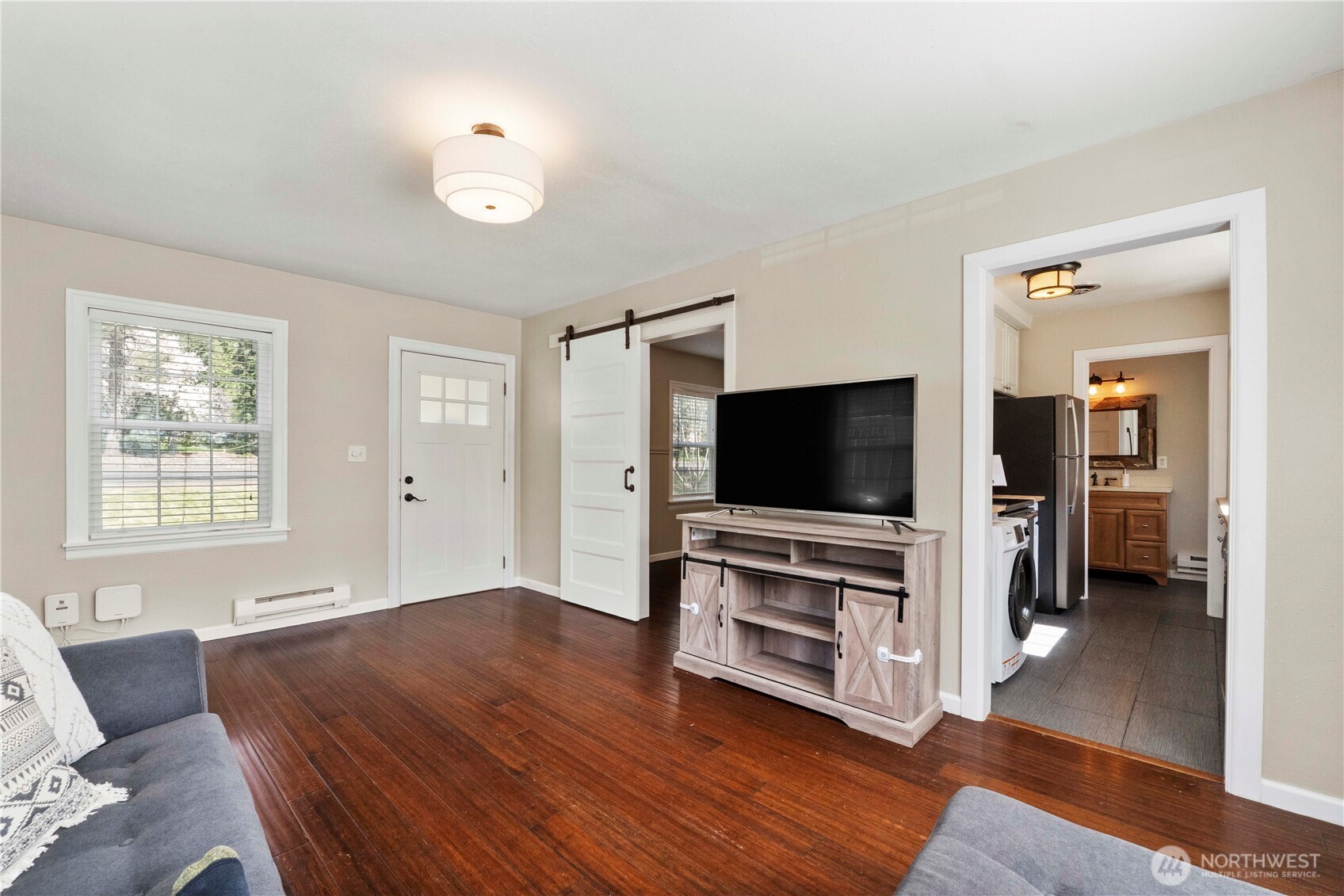 11716 48th Street East Edgewood, WA 98372 - Photo 5 of 29 a living room with furniture and a flat screen tv
