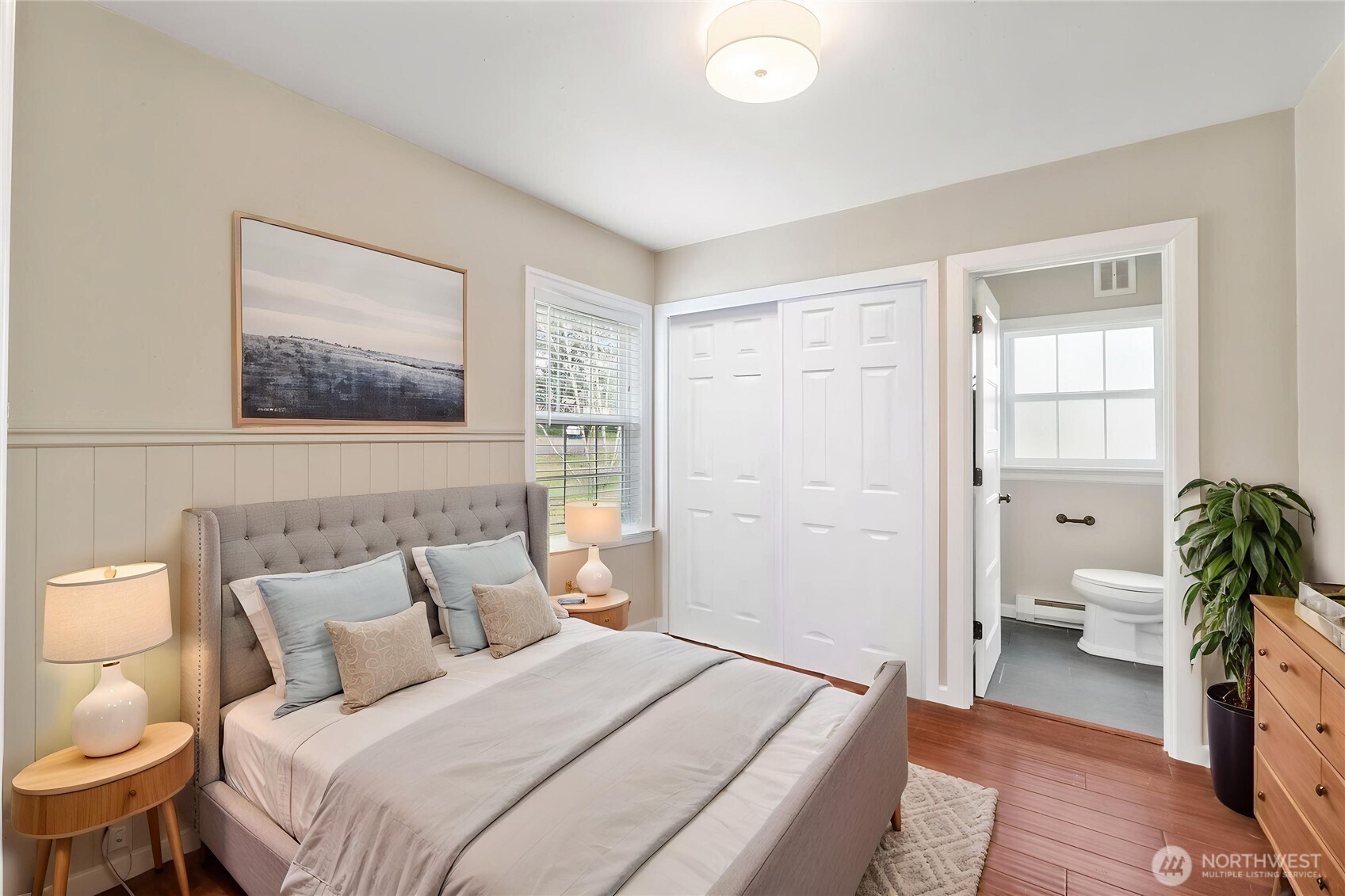 11716 48th Street East Edgewood, WA 98372 - Photo 9 of 29 a bedroom with a bed and a couch